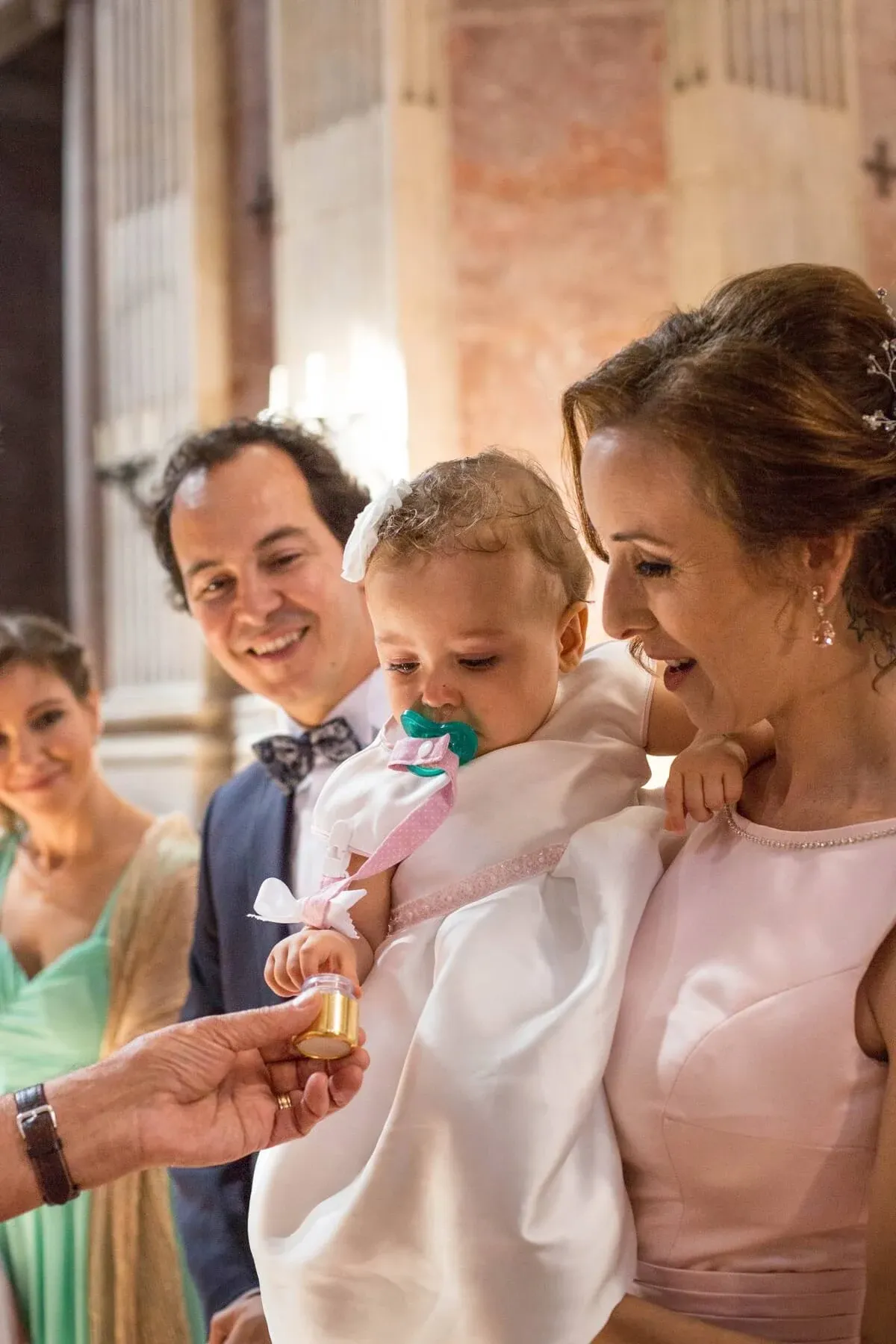 Família a celebrar um batizado